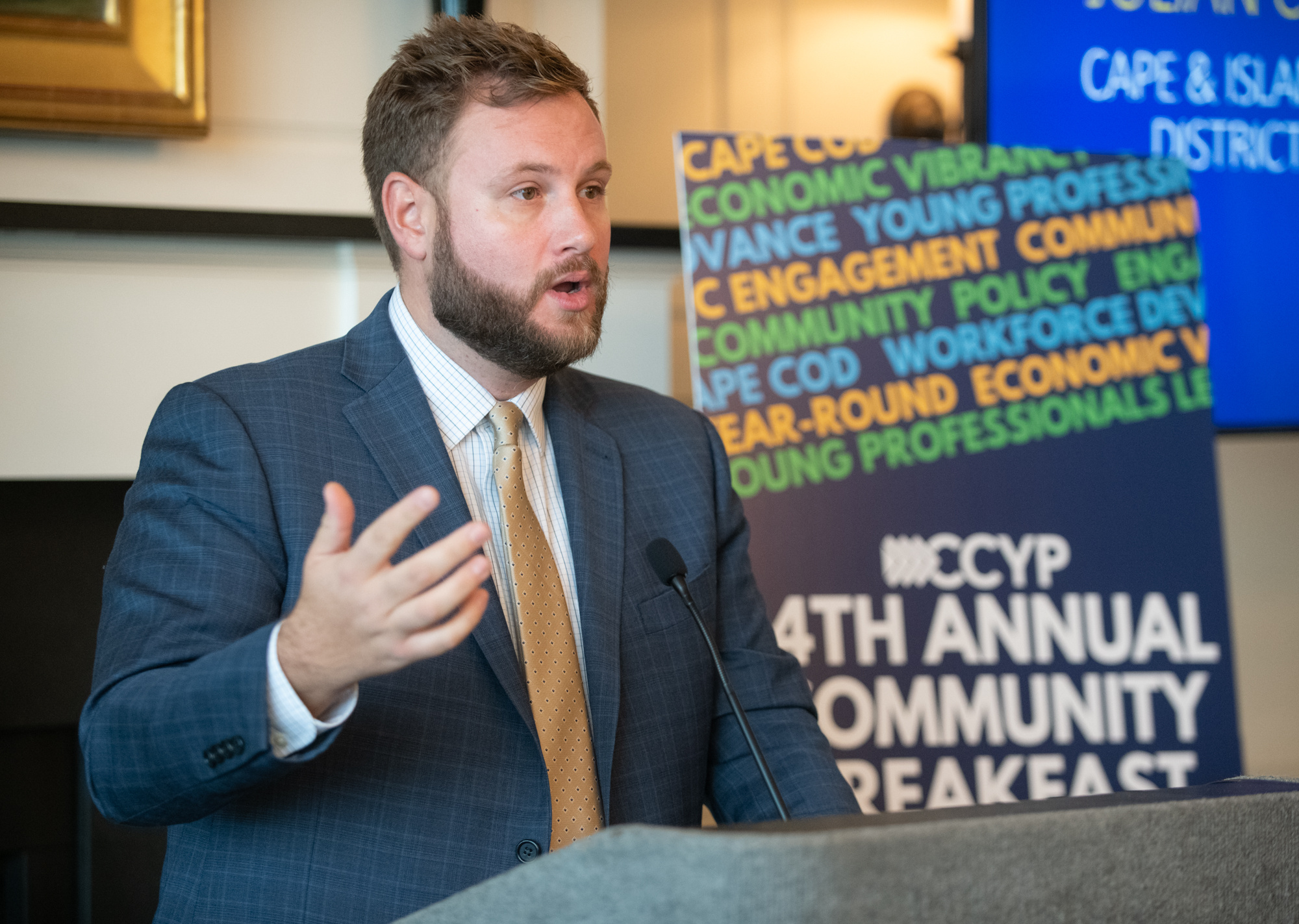 Senator Julian Cyr speaking at the annual Community Breakfast.